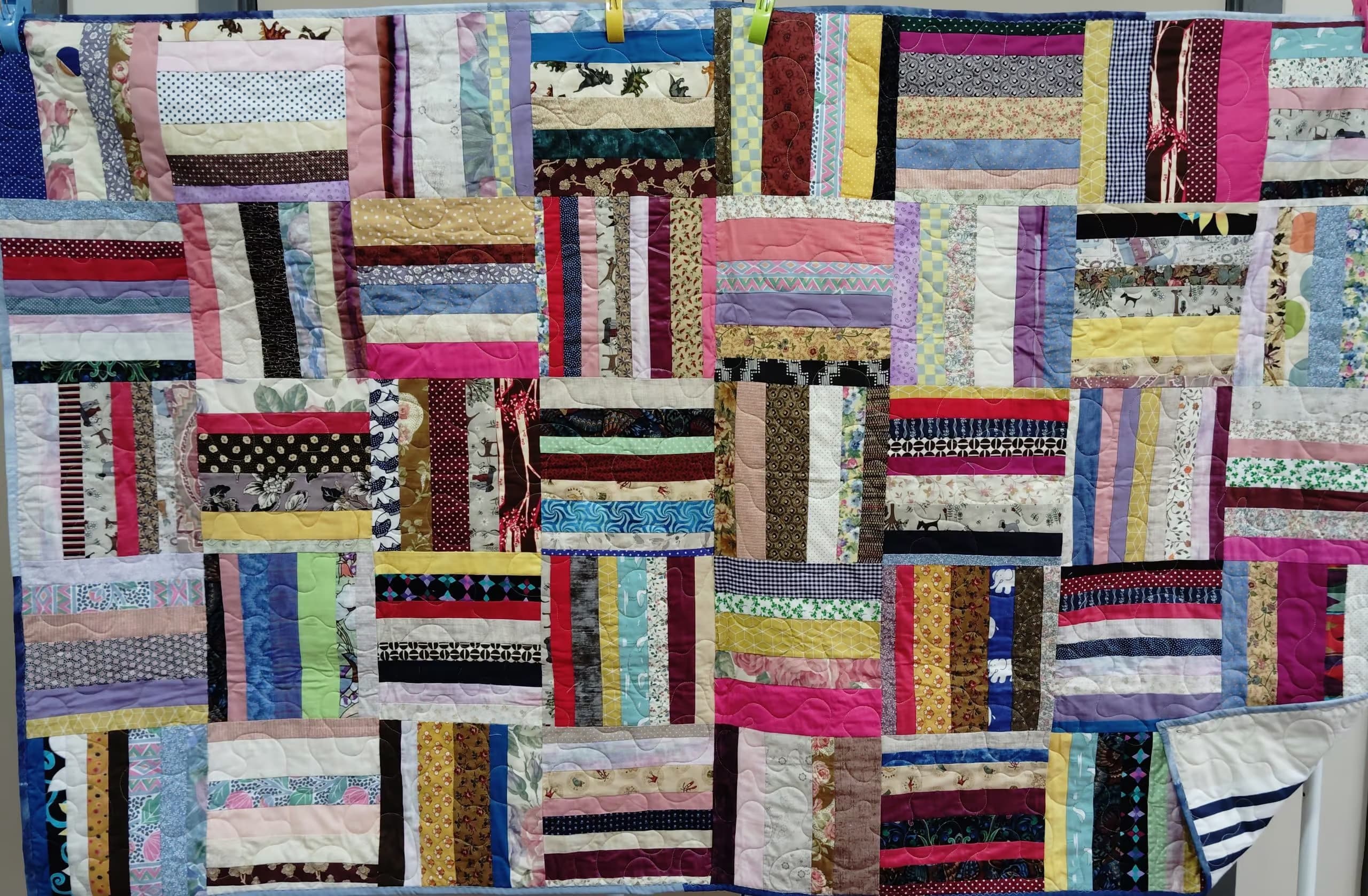 Stripey rail fence of various fabrics.