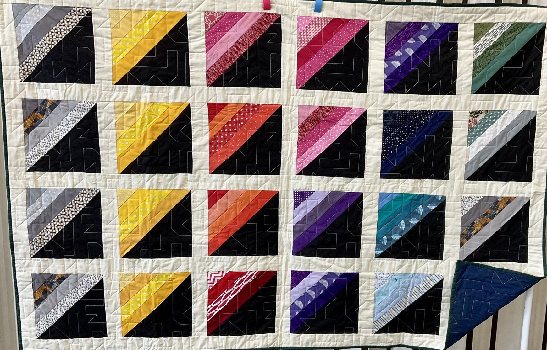  Multi coloured stripes and black triangles